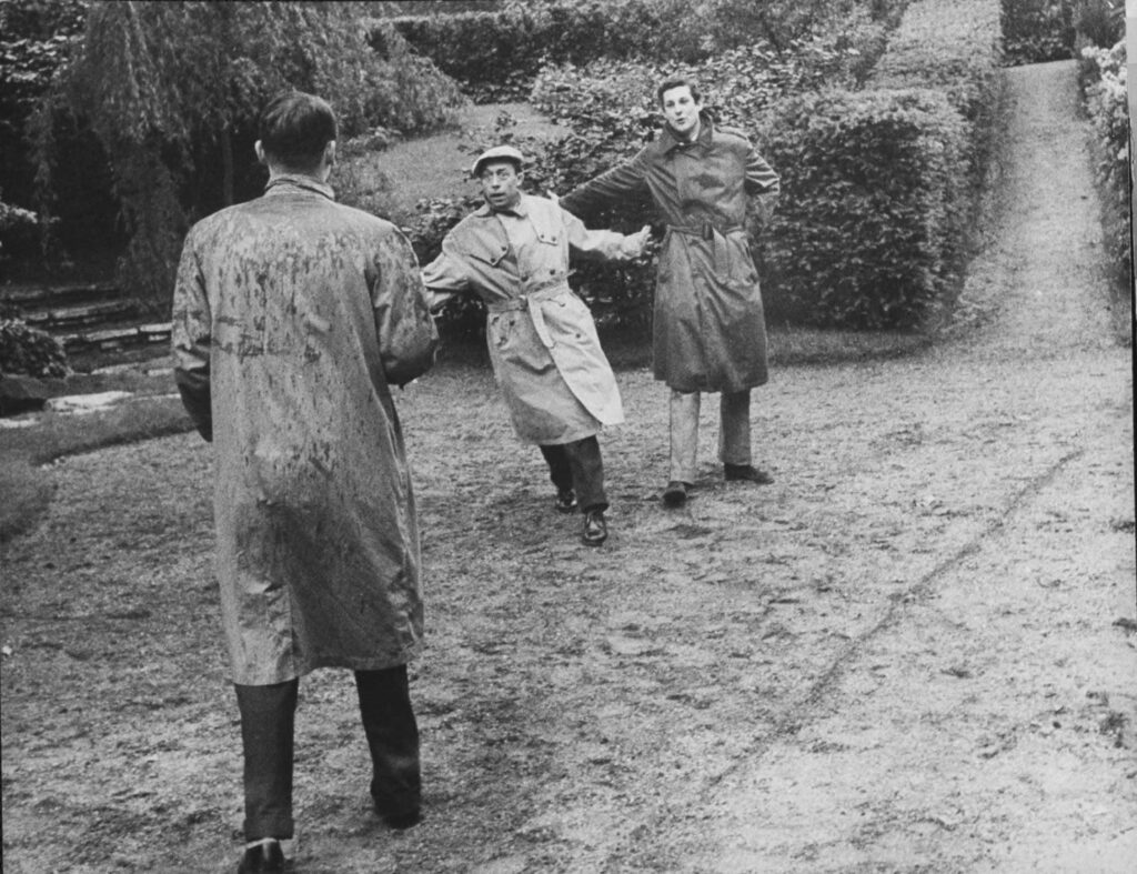 Albert Camus (center) rehearsed with actors for his play Caligula at an outdoor Shakespeare theater in Paris, 1957.