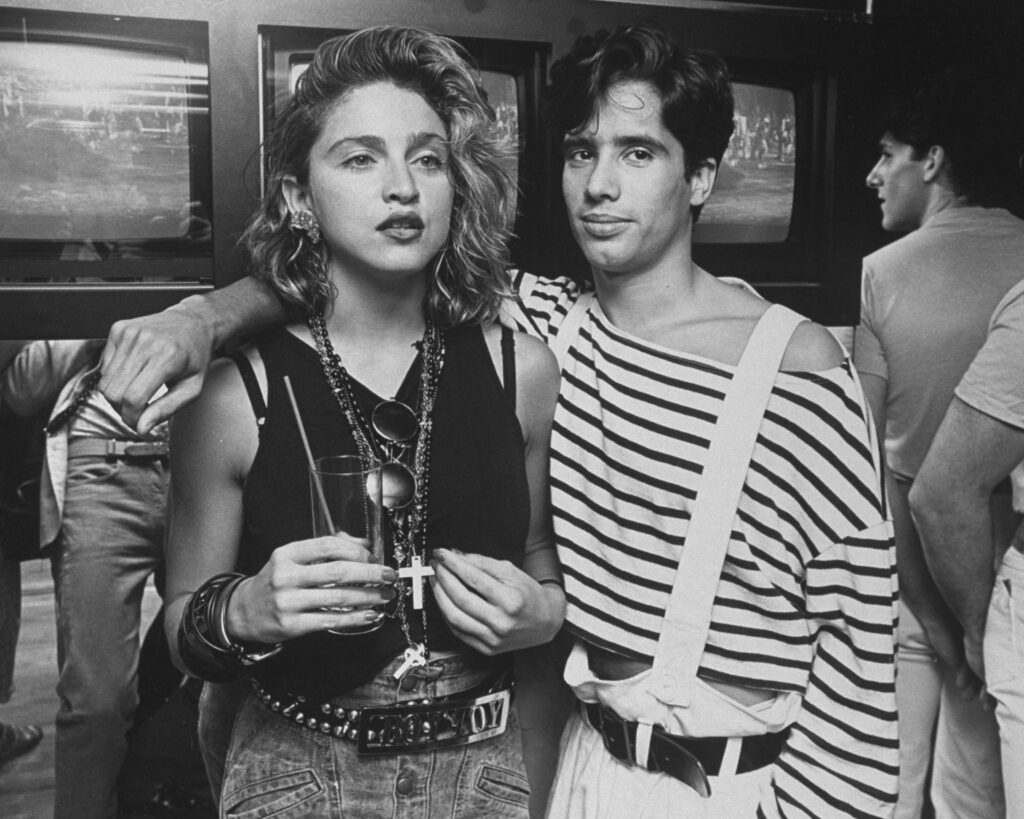 Singer Madonna with record producer Jellybean Benitez at tge opening of the club Private Eyes, 1984.