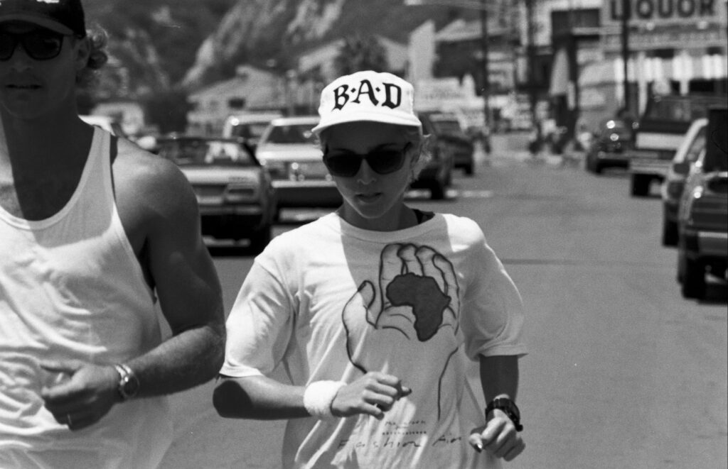 Madonna out for a run with a trainer, 1987.